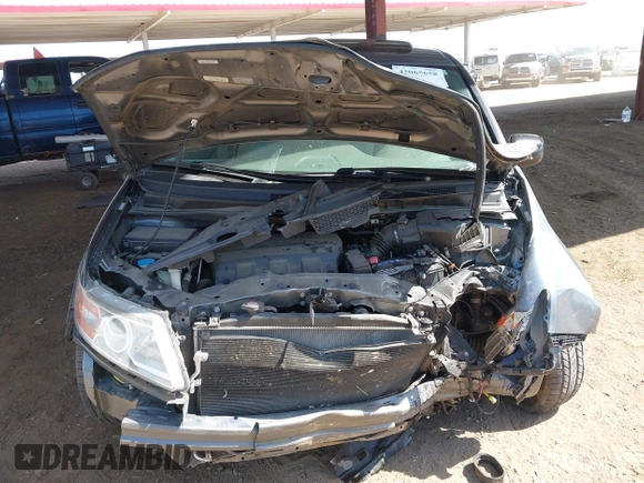 2012 Honda Odyssey EX-L with VIN 5FNRL5H6XCB103498, listed as a IAAI auction lot 42065658 with 104,933 mi miles and . Bid and sale history available at carsss.com. Image 10.