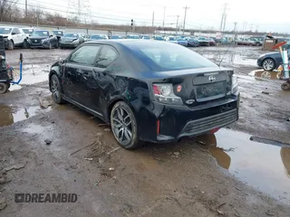 2014 Scion tC with VIN JTKJF5C74E3069104, listed as a IAAI auction lot 41579797 with 130,668 mi miles. Bid and sale history available at carsss.com. Image 3.