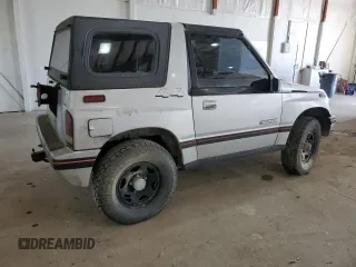 1990 Geo Tracker z VIN 2CNBJ18UXL6218795, wystawiony jako Copart lot #53083615 z przebiegiem 83 413 mil mil oraz Szkody całkowita. Historia ofert i sprzedaży dostępna na DreamBid. Obrazek 3.
