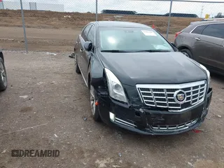 2015 Cadillac XTS Luxury z VIN 2G61M5S37F9288100, wystawiony jako IAAI lot #41867490 z przebiegiem 108 606 mil mil oraz . Historia ofert i sprzedaży dostępna na DreamBid. Obrazek 1.