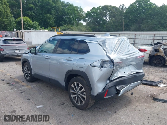 2023 Toyota Corolla Cross XLE with VIN 7MUDAAAG0PV057750, listed as a IAAI auction lot 42302284 with 31,404 mi miles and . Bid and sale history available at DreamBid. Image 3.