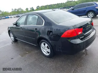 2010 Kia Optima LX with VIN KNAGG4A85A5375227, listed as a IAAI auction lot 42019118 with 221,324 mi miles. Bid and sale history available at carsss.com. Image 3.
