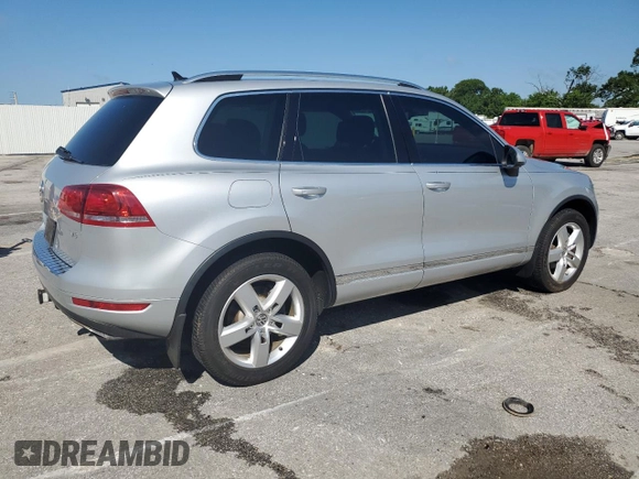 2014 Volkswagen Touareg Lux with VIN WVGEF9BP1ED012267, listed as a Copart auction lot 58924055 with 81,009 mi miles and Salvage title. Bid and sale history available at DreamBid. Image 3.