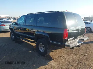 1999 GMC Suburban with VIN 3GKEC16R7XG527908, listed as a IAAI auction lot 41657788 with 216,894 mi miles. Bid and sale history available at carsss.com. Image 3.