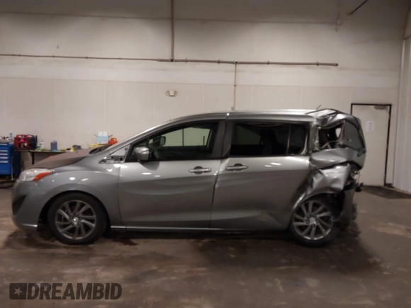 2012 Mazda 5 Sport z VIN JM1CW2BL1C0115371, wystawiony jako IAAI lot #42134834 z przebiegiem 138 840 mil mil oraz . Historia ofert i sprzedaży dostępna na DreamBid. Obrazek 14.