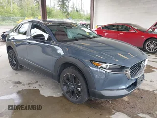 2023 Mazda CX-30 S Carbon Edition with VIN 3MVDMBCM1PM558865, listed as a IAAI auction lot 42298416 with 19,276 mi miles and . Bid and sale history available at DreamBid. Image 1.