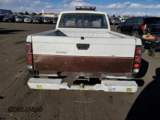 1987 Nissan Hardbody E z VIN JN6ND11S4HW011430, wystawiony jako Copart lot #81785214 z przebiegiem 334 566 mil mil oraz Tytuł czysty. Historia ofert i sprzedaży dostępna na DreamBid. Obrazek 6.