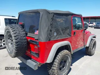 2005 Jeep Wrangler SE with VIN 1J4FA29S45P311320, listed as a IAAI auction lot 42095396 with 93,808 mi miles. Bid and sale history available at carsss.com. Image 4.
