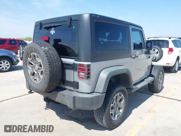 2014 Jeep Wrangler Sport with VIN 1C4AJWAG9EL155409, listed as a IAAI auction lot 41869906 with 102,400 mi miles and . Bid and sale history available at carsss.com. Image 4.