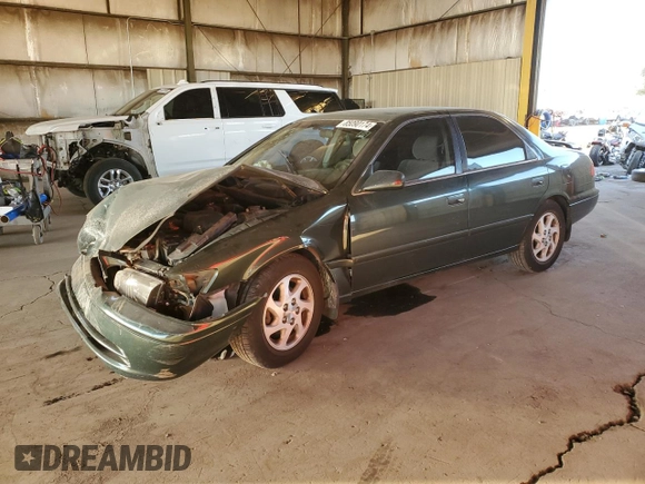 2001 Toyota Camry LE z VIN JT2BF22K510303027, wystawiony jako Copart lot #85090174 z przebiegiem 253 038 mil mil oraz Szkoda całkowita • Salvage title. Historia ofert i sprzedaży dostępna na DreamBid. Obrazek 1.