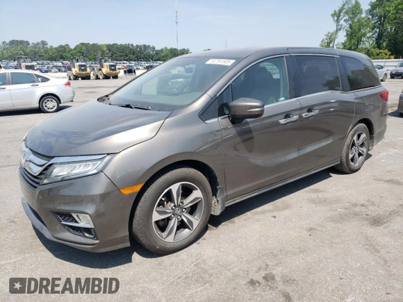 2019 Honda Odyssey Touring z VIN 5FNRL6H87KB098010, wystawiony jako Copart lot #54791505 z przebiegiem 94 477 mil mil oraz Szkoda całkowita • Salvage title. Historia ofert i sprzedaży dostępna na DreamBid. Obrazek 1.