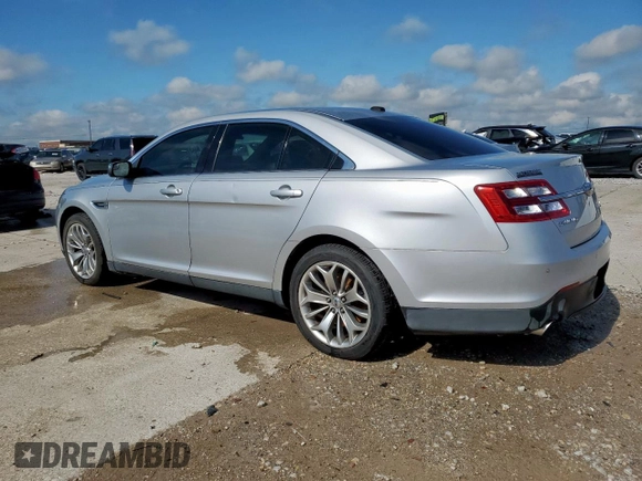 2013 Ford Taurus Limited with VIN 1FAHP2F84DG129904, listed as a Copart auction lot 58218205 with 105,877 mi miles and Salvage title. Bid and sale history available at DreamBid. Image 2.