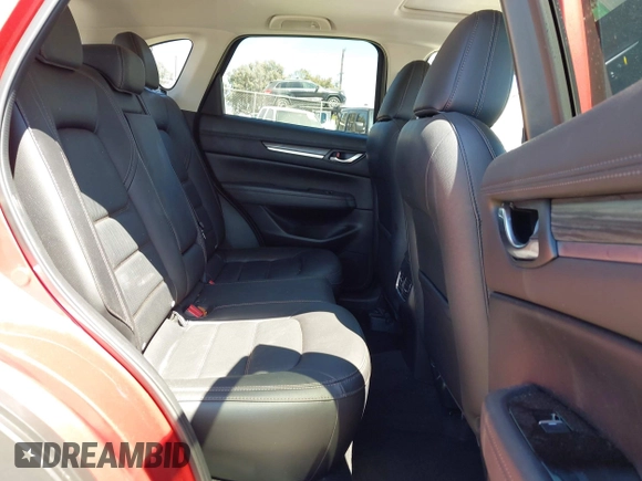 2021 Mazda CX-5 Grand Touring with VIN JM3KFADM5M0470483, listed as a IAAI auction lot 42785031 with 30,749 mi miles and . Bid and sale history available at DreamBid. Image 8.