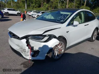 2016 Tesla Model X P90D with VIN 5YJXCAE4XGF000915, listed as a IAAI auction lot 41278587 with 98,728 mi miles. Bid and sale history available at carsss.com. Image 2.