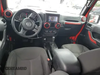 2015 Jeep Wrangler Unlimited Sport with VIN 1C4BJWDG6FL568082, listed as a Copart auction lot 58242945 with 114,637 mi miles and Salvage title. Bid and sale history available at DreamBid. Image 8.