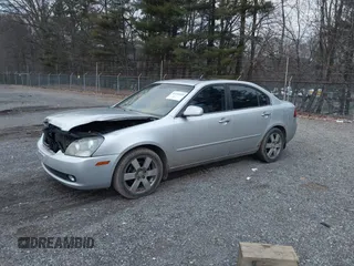 2007 Kia Optima EX with VIN KNAGE124375162317, listed as a IAAI auction lot 41246445 with 174,128 mi miles. Bid and sale history available at carsss.com. Image 2.