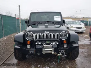 2011 Jeep Wrangler Unlimited Sahara with VIN 1J4BA5H12BL548870, listed as a IAAI auction lot 42010303 with 139,693 mi miles. Bid and sale history available at carsss.com. Image 12.