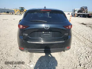 2021 Mazda CX-5 Touring z VIN JM3KFBCM5M0471172, wystawiony jako Copart lot #56646065 z przebiegiem 42 843 mil mil oraz Szkody całkowita. Historia ofert i sprzedaży dostępna na DreamBid. Obrazek 6.