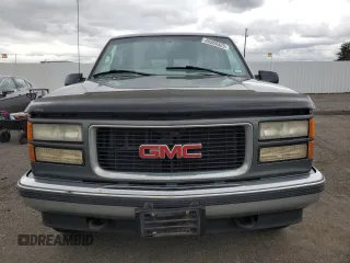 1999 GMC Suburban with VIN 1GKFK16R0XJ772880, listed as a Copart auction lot 46986325 with 237,921 mi miles and Clean Title. Bid and sale history available at carsss.com. Image 5.