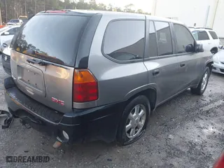 2005 GMC Envoy SLE with VIN 1GKDS13S352215032, listed as a IAAI auction lot 41221612 with 260,647 mi miles. Bid and sale history available at carsss.com. Image 4.