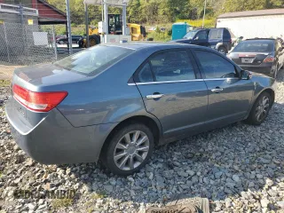 2012 Lincoln MKZ z VIN 3LNHL2GCXCR827302, wystawiony jako Copart lot #70519604 z przebiegiem 150 416 mil mil oraz Szkoda całkowita • Salvage title. Historia ofert i sprzedaży dostępna na DreamBid. Obrazek 3.