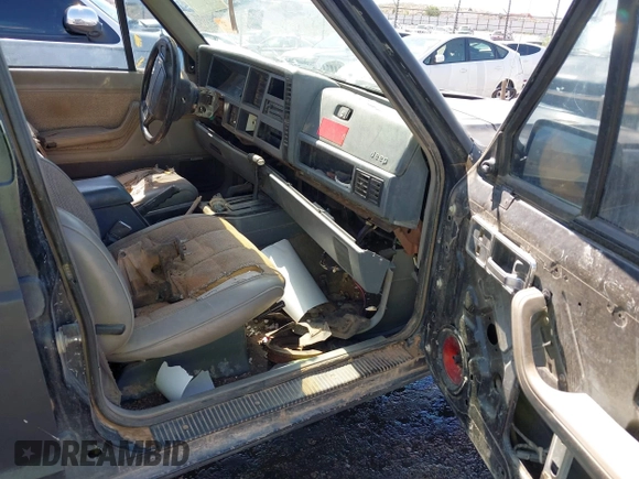 1995 Jeep Cherokee Sport with VIN 1J4FJ68S5SL541413, listed as a IAAI auction lot 42722408 with 335,432 mi miles and . Bid and sale history available at DreamBid. Image 5.