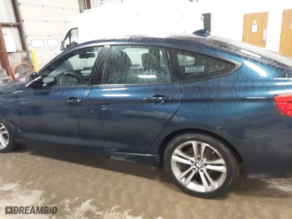 2014 BMW 3 Series Gran Turismo 328i xDrive with VIN WBA3X5C5XED557668, listed as a IAAI auction lot 41728522 with 123,393 mi miles. Bid and sale history available at carsss.com. Image 14.