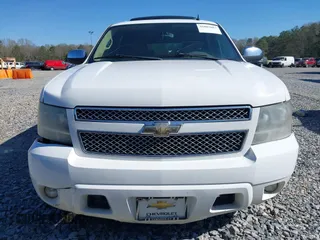 2011 Chevrolet Suburban LT with VIN 1GNSCJE05BR357775, listed as a IAAI auction lot 41807667 with 327,313 mi miles. Bid and sale history available at carsss.com. Image 12.