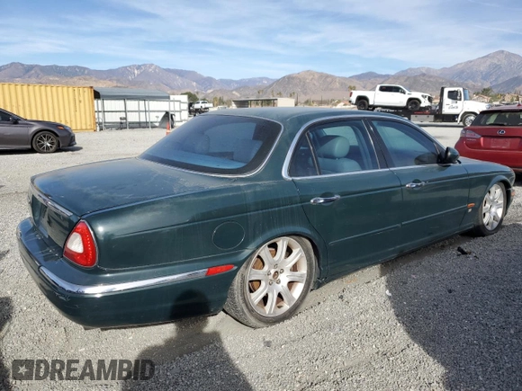2004 Jaguar XJ with VIN SAJWA71C34SG29498, listed as a Copart auction lot 42653715 with 116,956 mi miles and Salvage Title. Bid and sale history available at carsss.com. Image 3.
