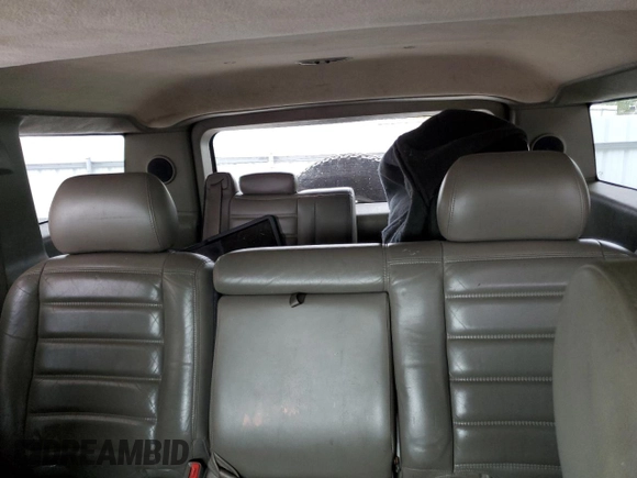 2003 Hummer H2 with VIN 5GRGN23U33H118459, listed as a Copart auction lot 77765694 with 157,390 mi miles and Salvage Title. Bid and sale history available at carsss.com. Image 10.