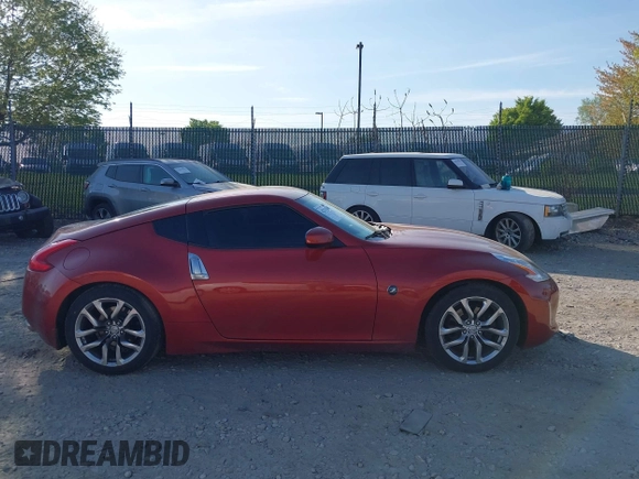 2014 Nissan 370Z Nismo with VIN JN1AZ4EH9EM636340, listed as a IAAI auction lot 42112548 with 143,894 mi miles and . Bid and sale history available at DreamBid. Image 14.