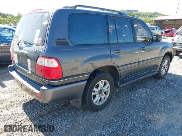 2003 Lexus LX with VIN JTJHT00W233532297, listed as a IAAI auction lot 42189676 with 235,992 mi miles. Bid and sale history available at carsss.com. Image 4.