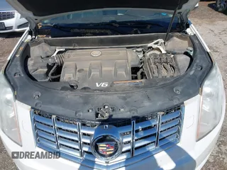 2013 Cadillac SRX Premium Collection with VIN 3GYFNEE33DS554556, listed as a IAAI auction lot 42152972 with 144,668 mi miles and . Bid and sale history available at DreamBid. Image 10.