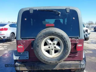 2003 Jeep Wrangler Sport with VIN 1J4FA49S33P345192, listed as a IAAI auction lot 41801344 with 196,472 mi miles. Bid and sale history available at carsss.com. Image 16.