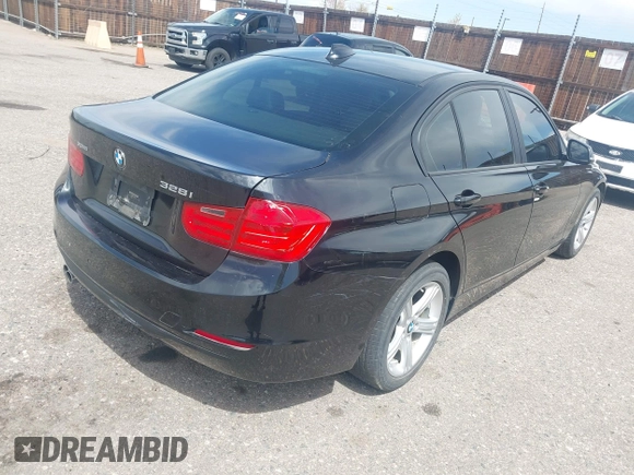 2014 BMW 3 Series 328i xDrive with VIN WBA3B3C56EJ981322, listed as a IAAI auction lot 42104530 with 104,376 mi miles. Bid and sale history available at carsss.com. Image 4.