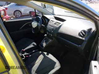 2014 Mazda 5 Sport z VIN JM1CW2BL0E0172678, wystawiony jako IAAI lot #42192057 z przebiegiem 89 848 mil mil oraz . Historia ofert i sprzedaży dostępna na DreamBid. Obrazek 5.