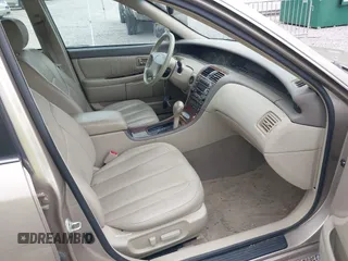 2001 Toyota Avalon XL z VIN 4T1BF28B71U192791, wystawiony jako IAAI lot #42180729 z przebiegiem 132 397 mil mil oraz . Historia ofert i sprzedaży dostępna na DreamBid. Obrazek 5.