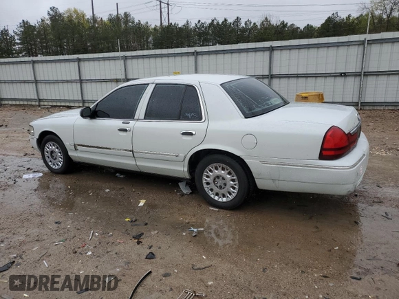 2003 Mercury Grand Marquis GS Convenience z VIN 2MEFM74W53X702387, wystawiony jako Copart lot #52852475 z przebiegiem 246 543 mil mil oraz Szkoda całkowita • Salvage title. Historia ofert i sprzedaży dostępna na DreamBid. Obrazek 2.