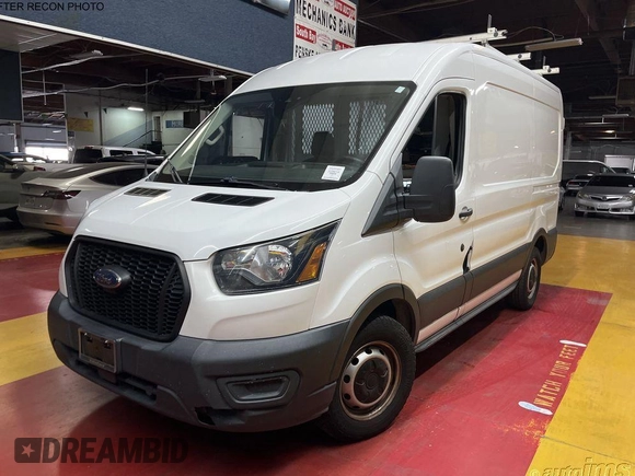 2021 Ford Transit Cargo with VIN 1FTYE1C87MKA94593, listed as a IAAI auction lot 42658954 with 99,425 mi miles and . Bid and sale history available at DreamBid. Image 10.