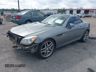 2015 Mercedes-Benz SLK 250 z VIN WDDPK4HA2FF099896, wystawiony jako IAAI lot #42333660 z przebiegiem 58 892 mil mil oraz . Historia ofert i sprzedaży dostępna na DreamBid. Obrazek 17.