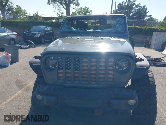 2021 Jeep Gladiator 80th Anniversary z VIN 1C6HJTAG7ML564981, wystawiony jako IAAI lot #42455062 z przebiegiem 89 721 mil mil oraz . Historia ofert i sprzedaży dostępna na DreamBid. Obrazek 12.