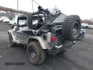 2001 Jeep Wrangler Sport with VIN 1J4FA49S41P355646, listed as a IAAI auction lot 41937746 with 160,634 mi miles. Bid and sale history available at carsss.com. Image 3.