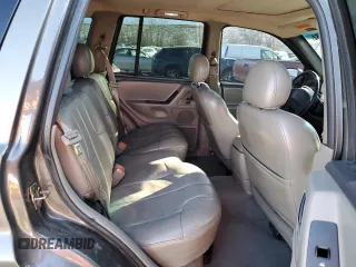 1999 Jeep Grand Cherokee Laredo with VIN 1J4GW58N9XC633464, listed as a Copart auction lot 84682454 with 212,738 mi miles and Salvage title. Bid and sale history available at DreamBid. Image 11.