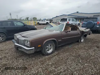 1977 Oldsmobile Cutlass z VIN 3J57R7M186772, wystawiony jako Copart lot #70648914 z przebiegiem 43 326 mil mil oraz Szkody całkowita. Historia ofert i sprzedaży dostępna na DreamBid. Obrazek 1.