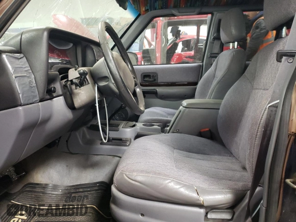 1997 Jeep Cherokee Country with VIN 1J4FJ78S0VL592781, listed as a Copart auction lot 83209464 with 287,206 mi miles and Salvage Title. Bid and sale history available at carsss.com. Image 7.