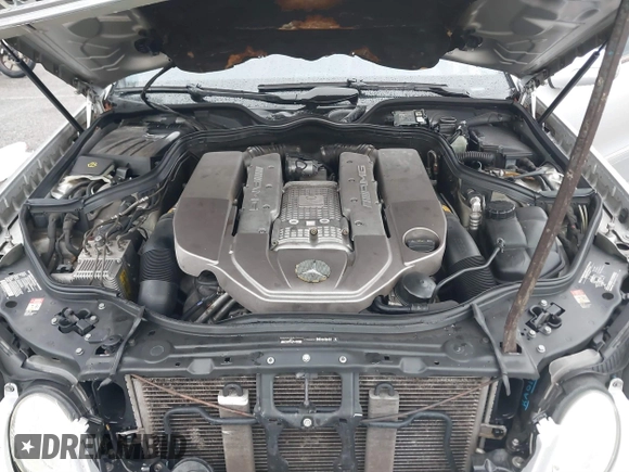 2003 Mercedes-Benz E-Class 5.5L AMG with VIN WDBUF76J93A351317, listed as a IAAI auction lot 41573446 with 144,119 mi miles. Bid and sale history available at carsss.com. Image 10.
