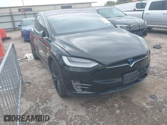 2021 Tesla Model X Long Range Plus with VIN 5YJXCAE27MF324270, listed as a IAAI auction lot 41886101 with 59,614 mi miles and . Bid and sale history available at carsss.com. Image 1.