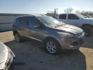 2014 Ford Escape Titanium with VIN 1FMCU9J90EUE48236, listed as a Copart auction lot 85134724 with 64,162 mi miles and Salvage Title. Bid and sale history available at carsss.com. Image 4.