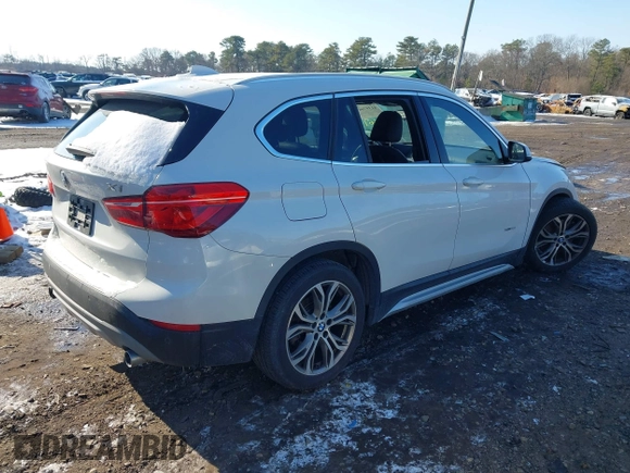 2017 BMW X1 xDrive28i with VIN WBXHT3Z36H4A52364, listed as a IAAI auction lot 41397667 with 61,960 mi miles. Bid and sale history available at carsss.com. Image 4.