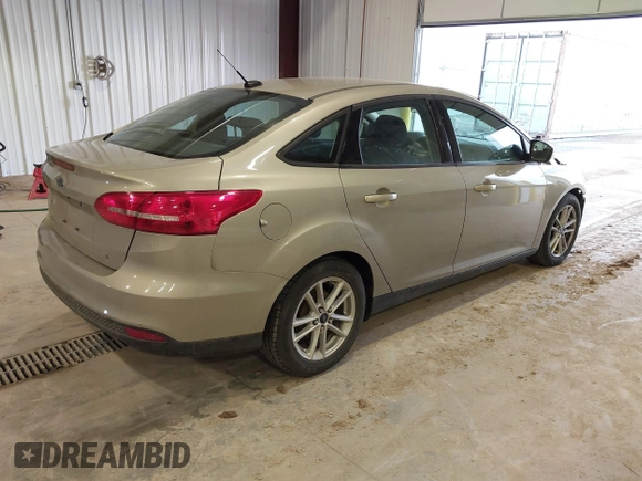 2016 Ford Focus SE z VIN 1FADP3F23GL277537, wystawiony jako IAAI lot #41603658 z przebiegiem 107 115 mil mil oraz . Historia ofert i sprzedaży dostępna na DreamBid. Obrazek 4.